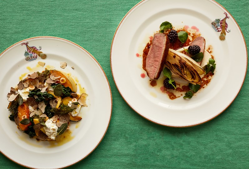 Autumn dishes served atop a green table cloth