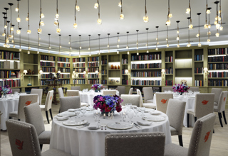 Round dining tables set-up in the Reading private events room at the Whitby Hotel