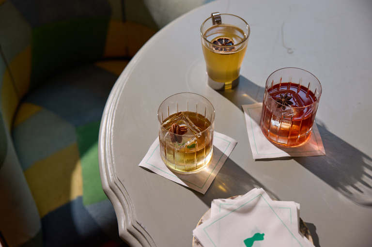 A selection of fall cocktails sit on a marble table in the Bar at Warren Street Hotel New York