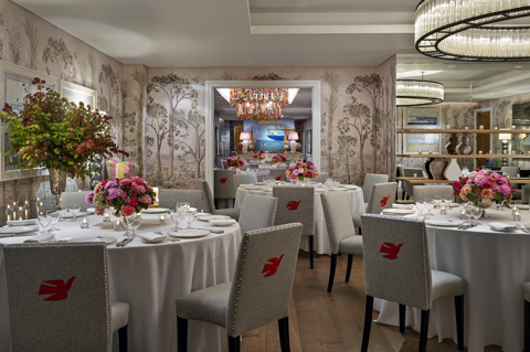 Round dining tables set-up in the Prince private events room looking over the Spring room at Crosby Street Hotel