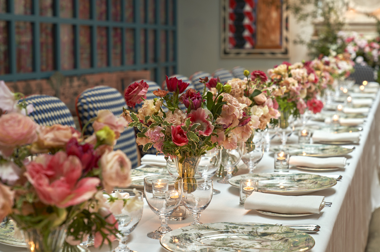 Close shot of a long dining table set-up in the Orangery private events room at Warren Street Hotel