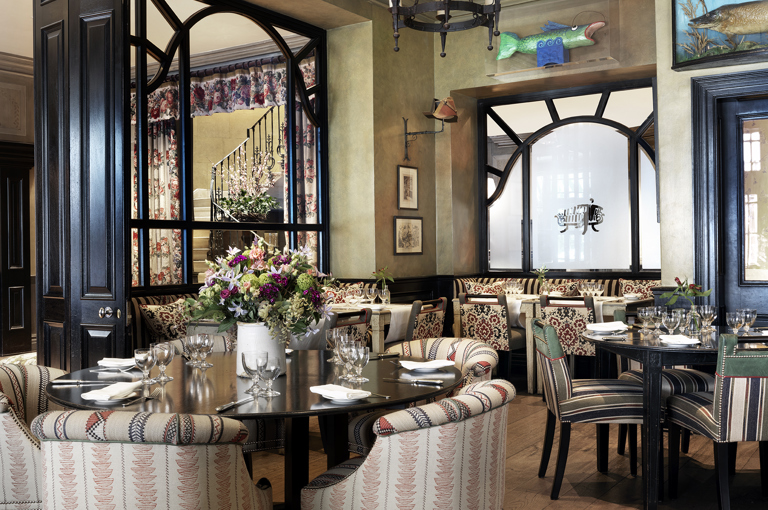 Diagonal shot of Brasserie Max set up for dinner at Covent Garden Hotel.