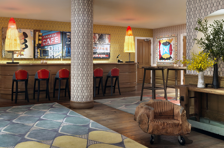 Wide shot of the reception bar in the private events lobby at Crosby Street Hotel