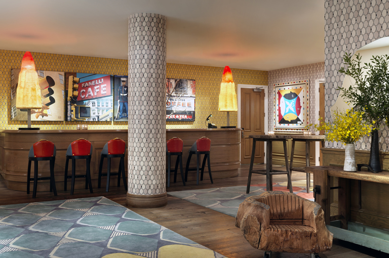 Wide shot of the reception bar in the private events lobby at Crosby Street Hotel